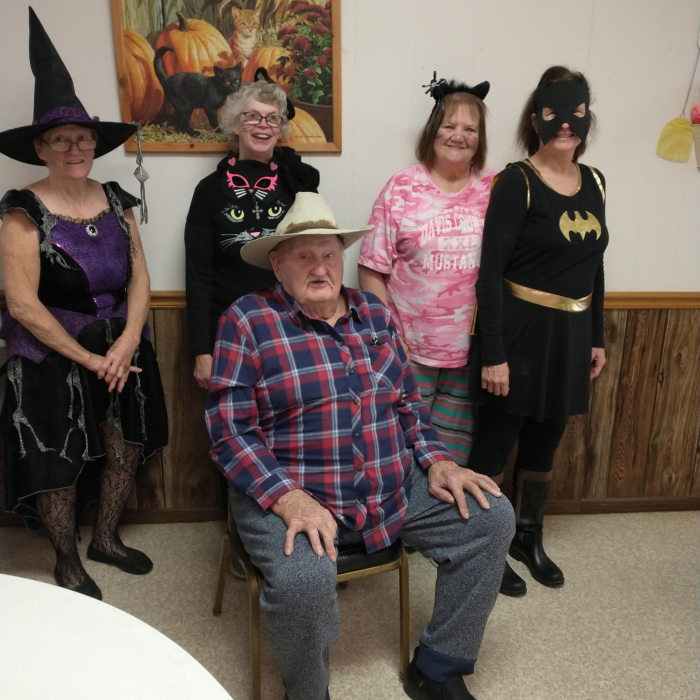 community café seniors with Halloween costumes