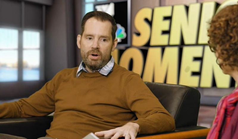Man speaking to television host