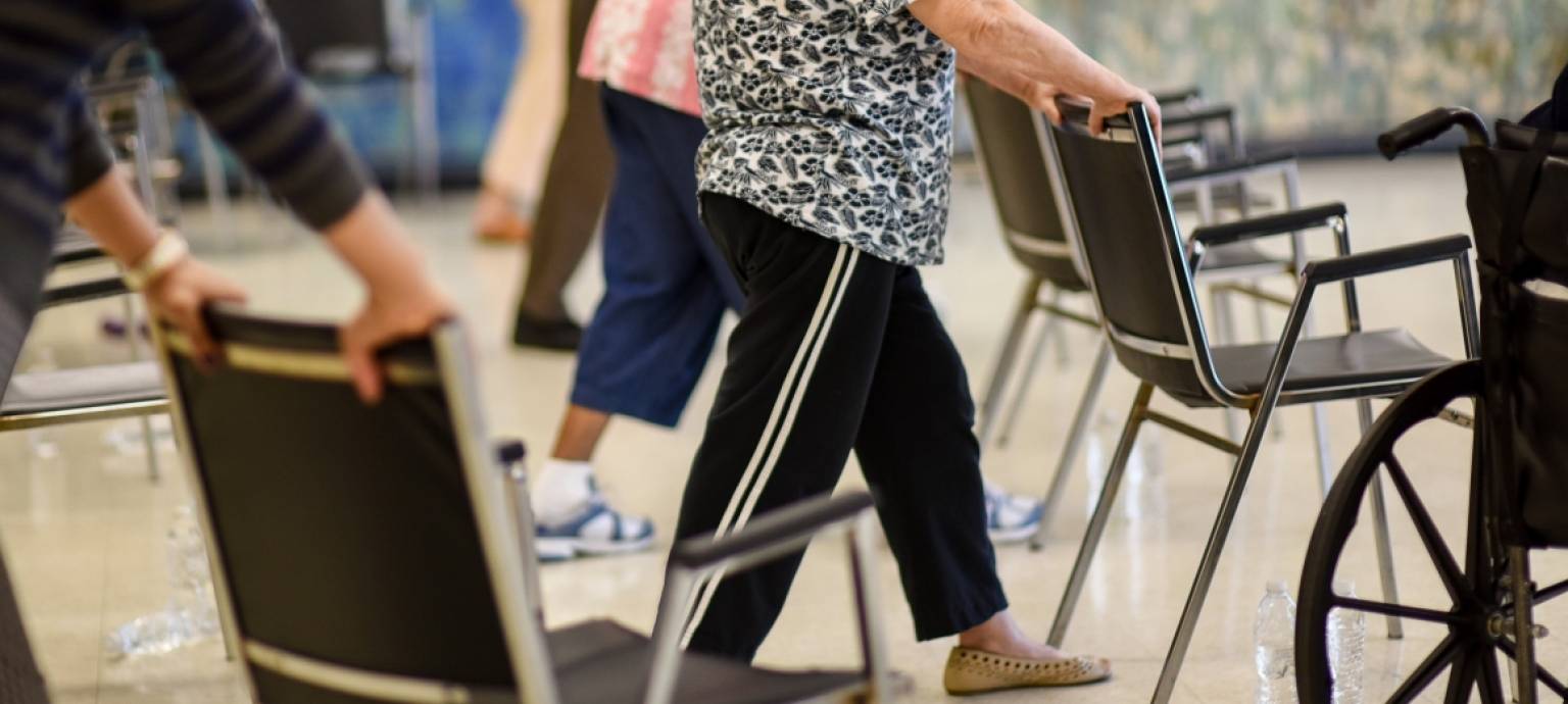 seniors exercising at chairs